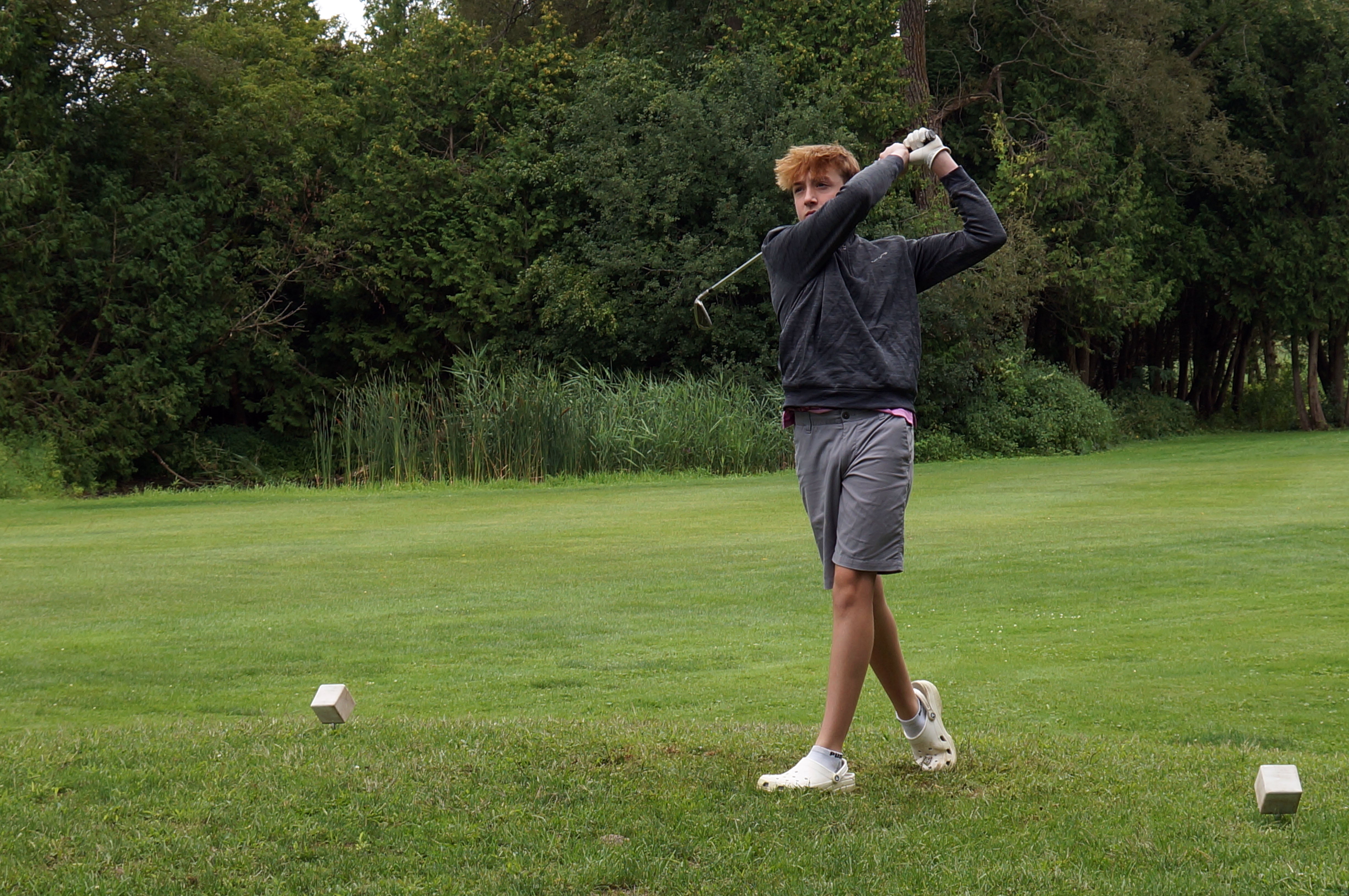 A golfer enjoying a round at Grafton Creekside